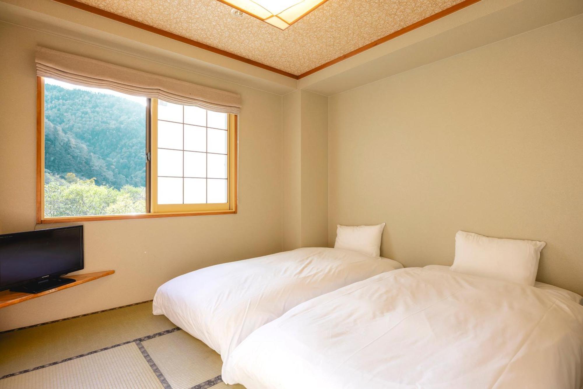 Hotel Shikishimaso à Higashikawa Extérieur photo